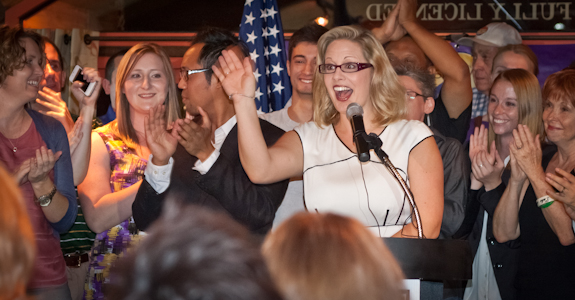 Former Arizona Senator Kyrsten Sinema acknowledges supporters and campaign staff during her Democratic primary victory speech. (Photo by Evan Wyloge/Arizona Capitol Times)