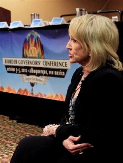 Arizona Gov. Jan Brewer sits down for an interview with a television reporter following the 30th annual Border Governors Conference in Albuquerque, N.M., on Friday, Oct. 5, 2012. Governors from both sides of the U.S.-Mexico border meet for two days to discuss everything from economic development and health care to border violence. (AP Photo/Susan Montoya Bryan)