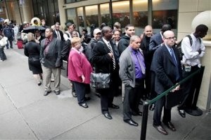 In this Wednesday, Oct. 24, 2012, photo, job seekers wait in line to see employers at a National Career Fairs' job fair in New York. Unemployment rates declined in October in more than half of the 372 largest U.S. cities, further evidence of steady improvement in the job market. (AP Photo/Bebeto Matthews)