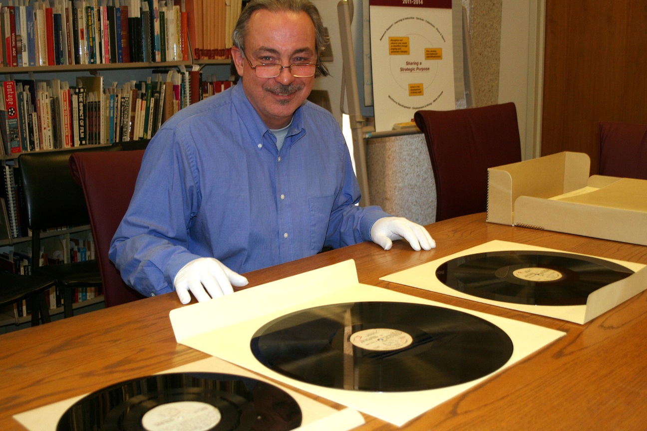 Robert Spindler, archivist and curator for the Arizona Collection at ASU Libraries, displays some recordings former Arizona Gov. Howard Pyle made as a radio broadcaster. In time for Veterans Day, ASU has made available online many of the messages home Pyle recorded for Arizonans serving in World War II. (Cronkite News Service Photo by Corbin Carson)