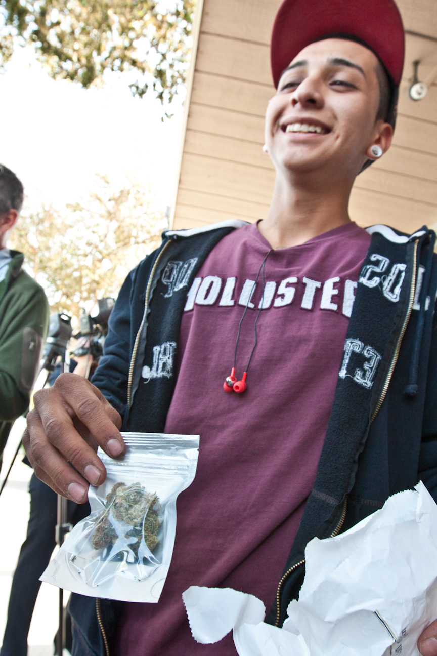 Peoria resident Michael Cardenas, 19, said he’s happy to finally have a place he can purchase medical marijuana. Cardenas was one of several people waiting Dec. 6 to buy pot from Arizona Organix, the state's first medical marijuana dispensary. (Photo by Evan Wyloge/Arizona Capitol Times.)