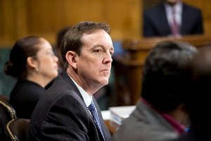 Arizona Secretary of State Ken Bennett waits to testify before the the Senate Judiciary Committee as Senate Democrats and Republicans spar over whether voter ID laws, attempts to purge voter rolls and restricted early voting were legitimate efforts to stop fraud or Republican strategies to hold down Democratic votes, on Capitol Hill in Washington, Wednesday, Dec. 19, 2012. (AP Photo/J. Scott Applewhite)