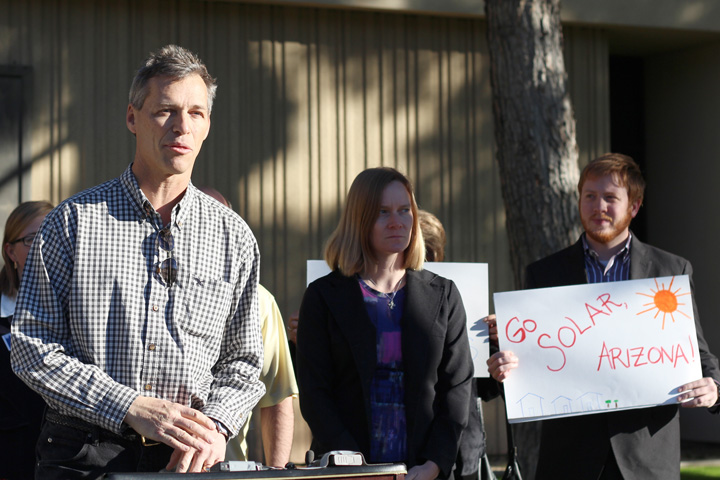 Randy Dunton (left) of Hawkins Design Group speaks at a rally Wednesday in front of the Arizona Corporation Commission. Environmentalists and solar industry leaders spoke out against cuts to renewable energy incentives and said they fear even more cuts. (Cronkite News Service Photo by Julia Tylor)