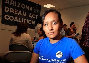 In this Aug. 15, 2012 file photo, young immigrant Erika Andiola, of Mesa, Ariz., poses for a portrait at a site where people line up to get guidance on a new federal program, called Deferred Action, that would help them avoid deportation in Phoenix, Arizona. The mother and a brother of Andiola were arrested Thursday evening, Jan. 10, 2013 at the family's Phoenix-area home. Andiola says ICE agents said there was a long-pending deportation order for her mother. The brother was released early Friday, Jan. 11, 2013, while the mother was transported to an immigration detention center in Florence. Another brother says the family has been told by the Mexican consulate in Mexico that the mother would be released after being returned to Phoenix. (AP Photo/Ross D. Franklin, File)