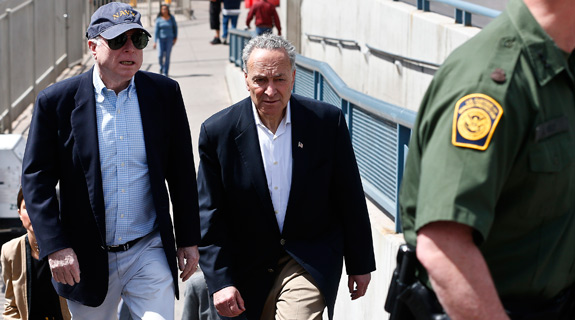 U.S. Sen. John McCain, R-Ariz., left, and Sen. Chuck Schumer, D-N.Y., tour the Nogales port of entry during their tour of the Mexico border with the United States on Wednesday, March 27, 2013, in Nogales, Ariz. (AP Photo/Ross D. Franklin)