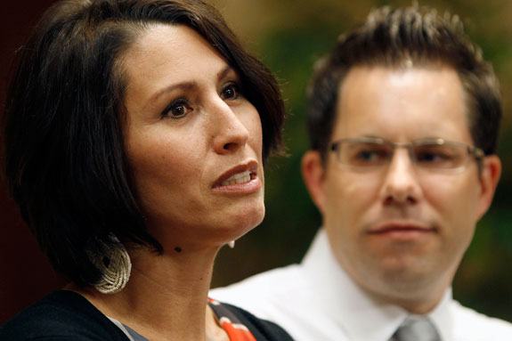 Yanira Maldonado, 42, accompanied by her husband, Gary, speaks to the media after arriving home, Friday, May 31, 2013 in Goodyear, Ariz. Maldonado was released from a prison on the outskirts of Nogales, Mexico late Thursday, May 30, 2013 after being jailed in Mexico on a drug-smuggling charge. She was released after court officials reviewed her case. Maldonado was arrested by the Mexican military last week after they found nearly 12 pounds (5.4 kilograms) of Marijuana under her seat on the commercial bus traveling from Mexico to Arizona. (AP Photo/Ralph Freso)