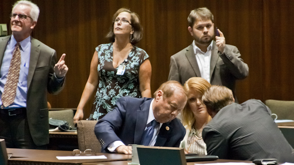 (From left) Republican Reps. Frank Pratt, Heather Carter and Ethan Orr huddle in discussion late Tuesday, after Gov. Jan Brewer called for a special session to pass a 2014 budget and her Medicaid expansion plan. (Photo by Evan Wyloge/Arizona Capitol Times)