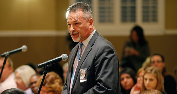 Arizona Dept. of Juvenile Corrections Director Charles Flanagan speak during a public forum intended to solicit ideas on improving the Child Protective Services agency amid revelations that more than 6,500 child abuse and welfare reports were illegally closed without an investigation, Tuesday, Dec. 3, 2013, in Phoenix. (AP Photo/Matt York)