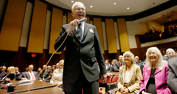 Rep. John Kavanagh, R-Fountain Hills, smiles as he addresses the legislature in the Arizona House of Representatives at the Arizona Capitol Monday, Jan. 13, 2014, in Phoenix. The Republican lawmaker wants the state constitution amended to allow cuts to public employee pensions and increases in employee contributions if the systems are badly underfunded. (AP Photo/Ross D. Franklin)