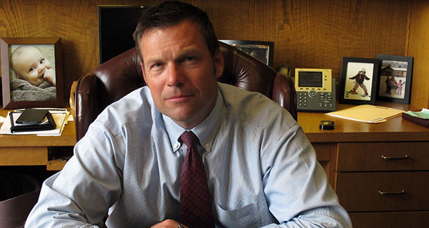 In this photo from Thursday, Aug. 1, 2013, Kansas Secretary of State Kris Kobach answers questions during an Associated Press interview in Topeka, Kan. Kobach is the architect of a state law requiring voters to show photo identification at the polls. (AP Photo/John Hanna)