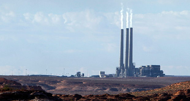 This Sept. 4, 2011 file photo shows the main plant facility at the Navajo Generating Station, as seen from Lake Powell in Page, Ariz. (AP Photo/Ross D. Franklin, File)