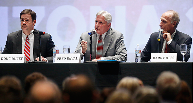 Arizona candidates for governor, from left, republican Doug Ducey, democrat Fred DuVal and libertarian Barry Hess during a public debate at the Jewish Community Center, on Thursday, Sept. 18, 2014, in Tucson, Ariz. (AP Photo/Arizona Daily Star, Mike Christy)