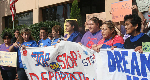 Arizona residents Andrea Adum, fourth from right, and Mayra Canales, to her left, were arrested at an immigration reform protest at the Democratic National Committee. (Cronkite News photo by Laurie Liles)