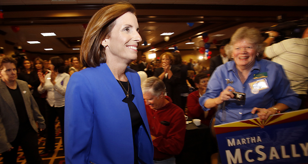 In a Tuesday, Nov. 4, 2014 photo, Martha McSally, Republican candidate for Congressional District 2, enters a ballroom for an election party, in Tucson, Ariz. On Monday, Nov. 10, lawyers for McSally are asking a judge to block the counting of some provisional ballots in her race against Democratic Rep. Ron Barber. Monday's request for a restraining order comes a day after Pima County Recorder F. Ann Rodriguez refused a demand that she stop verifying provisional ballots that lack an election worker's signature. (AP Photo/Arizona Daily Star, Mamta Popat)