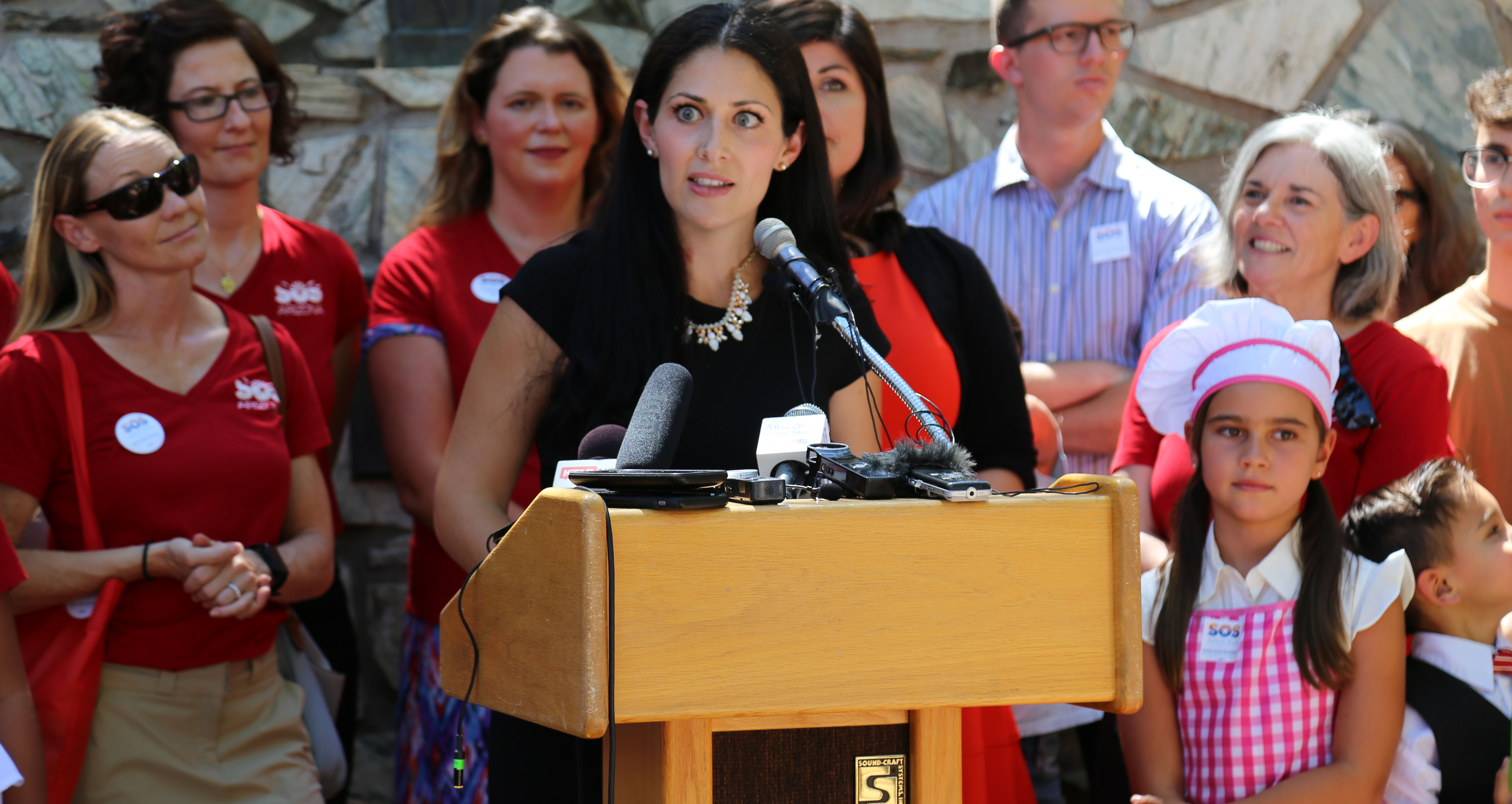 Save Our Schools Arizona spokeswoman Dawn Penich-Thacker addresses a crowd of volunteers and reporters after submitting more than 110,000 signatures to refer school voucher legislation to the 2018 ballot. The signatures were enough to put the legislation temporarily on hold on Aug. 8. (Photo by Katie Campbell/Arizona Capitol Times)