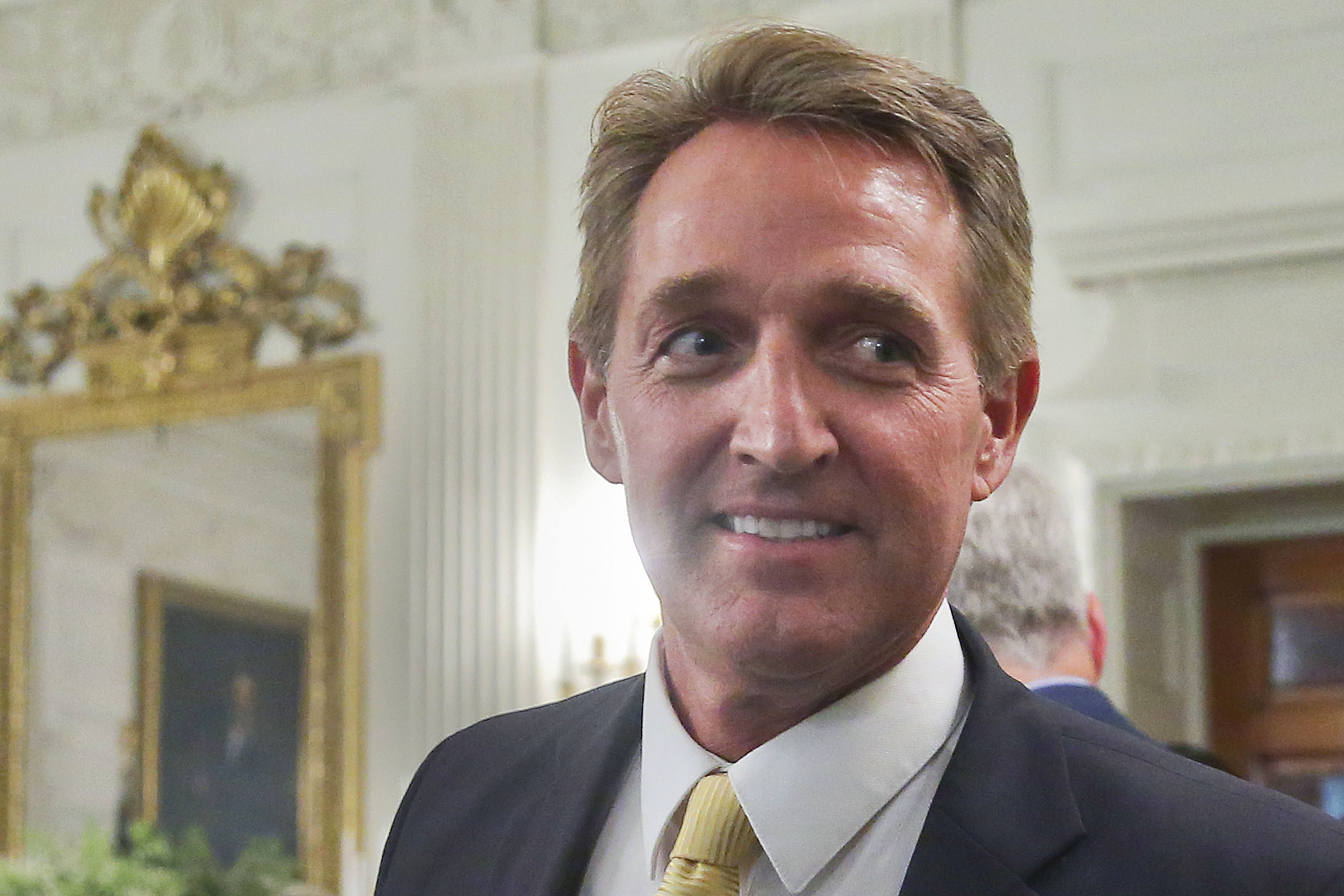 In this July 19, 2017 photo, Sen. Jeff Flake, R-Ariz. walks to his seat as he attends a luncheon with other GOP Senators and President Donald Trump at the White House in Washington. Flake’s re-election race is becoming a case study in the GOP’s convulsions between the establishment, a furious base, and angry donors. (AP Photo/Pablo Martinez Monsivais, File)