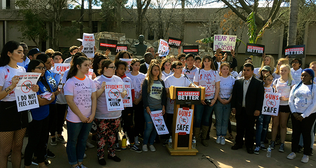 Jordan Harb, 17, speaks at a news conference while surrounded by other student demonstrators at the state Capitol in Phoenix on Wednesday, March 14, 2018. Arizona high school students gathered on campuses and met with lawmakers at the state Capitol in Phoenix on Wednesday to protest the kind of gun violence that recently killed 17 young people in Florida. (AP Photo/Terry Tang)