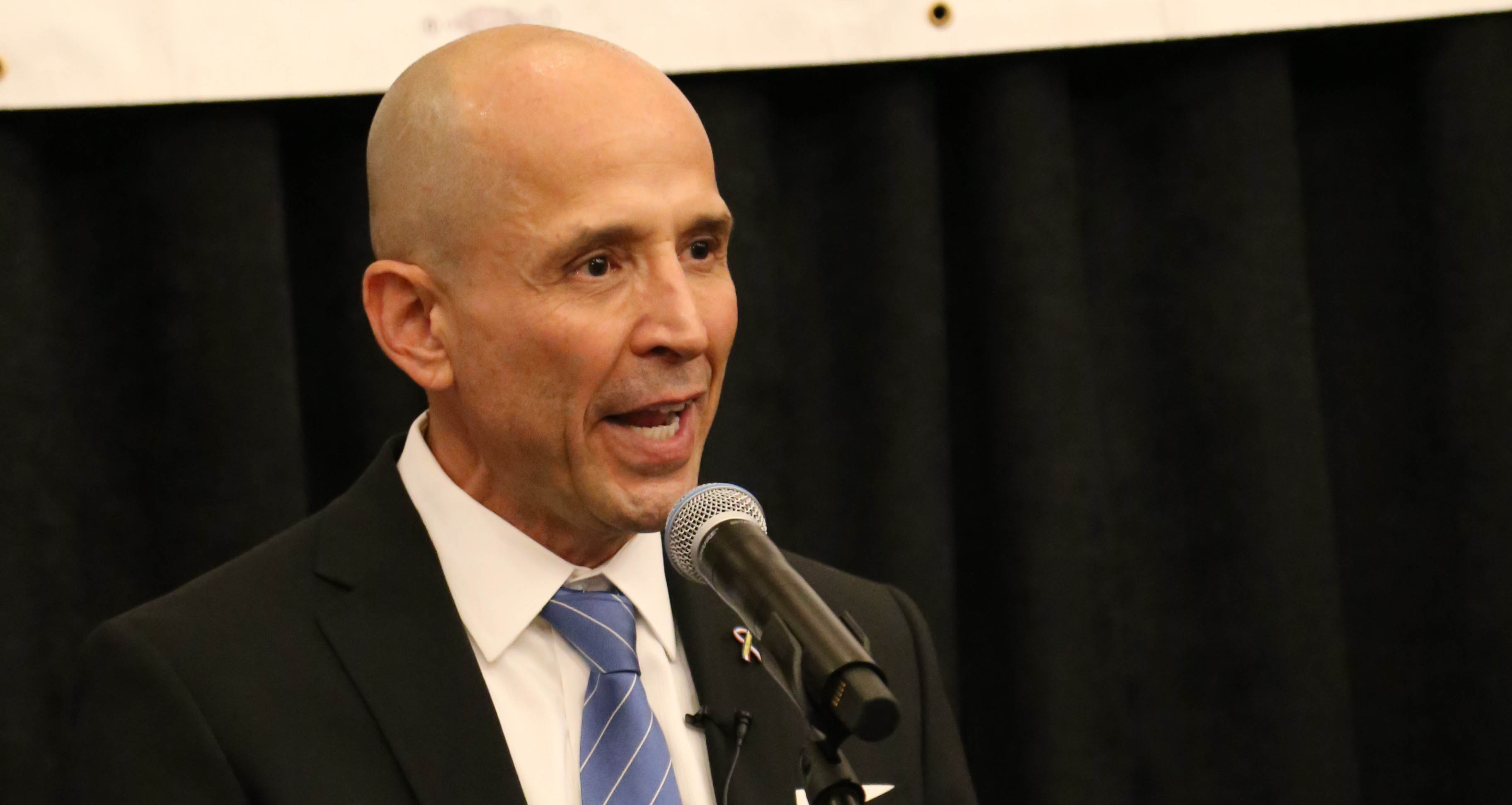 Democratic gubernatorial nominee David Garcia gives a victory speech after winning a three-way Democratic primary challenge Tuesday. Garcia, who will take on Gov. Doug Ducey in the governor's race, spoke to more than a hundred supporters packed into a Phoenix bar and restaurant. PHOTO BY CARMEN FORMAN/ARIZONA CAPITOL TIMES