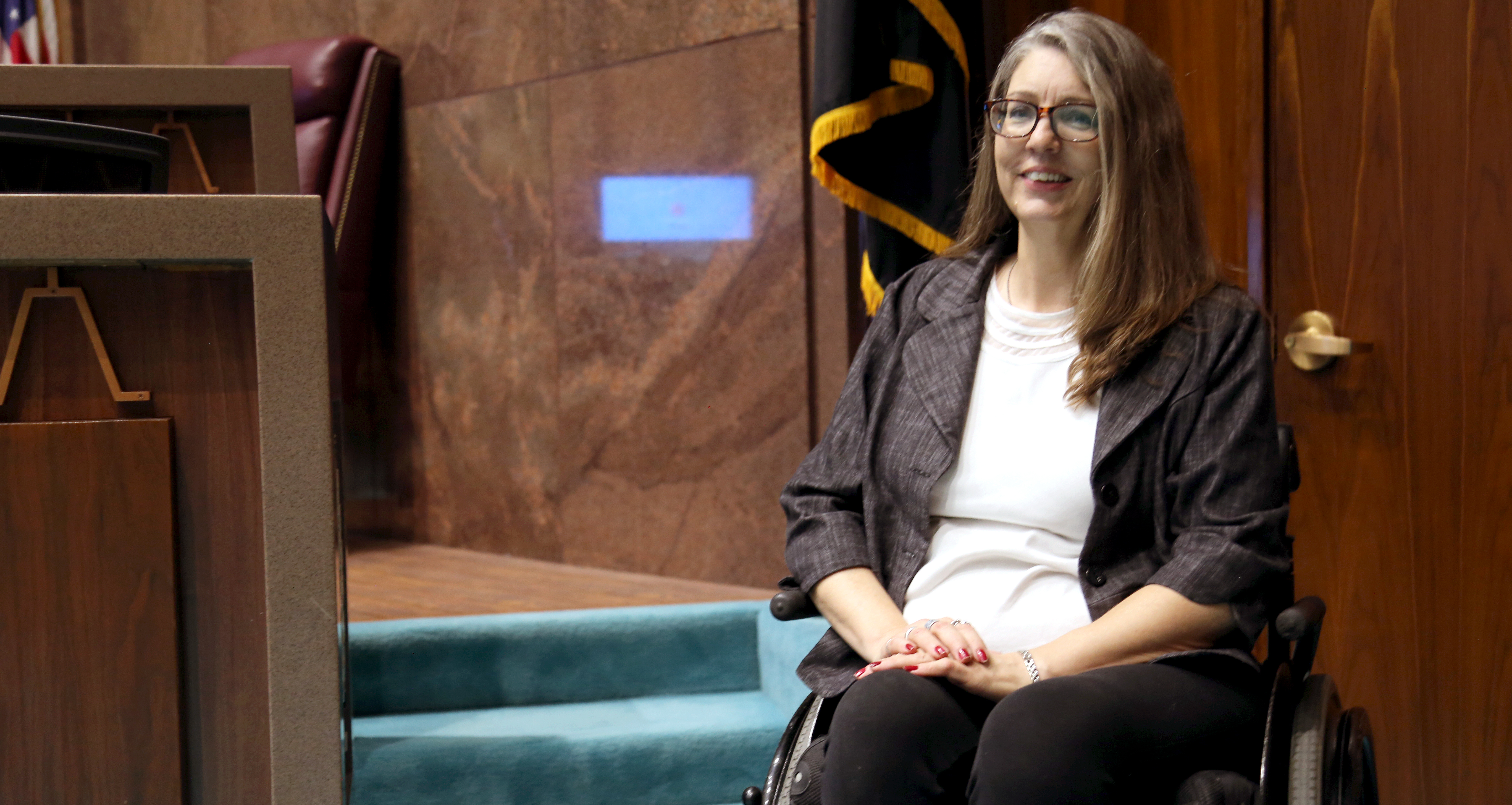 Jennifer Longdon, a presumptive state representative from Legislative District 24, poses before a set of stairs to the speaker's desk. "It's more than our numbers that keep me from being speaker," she said. (Photo by Katie Campbell/Arizona Capitol Times)