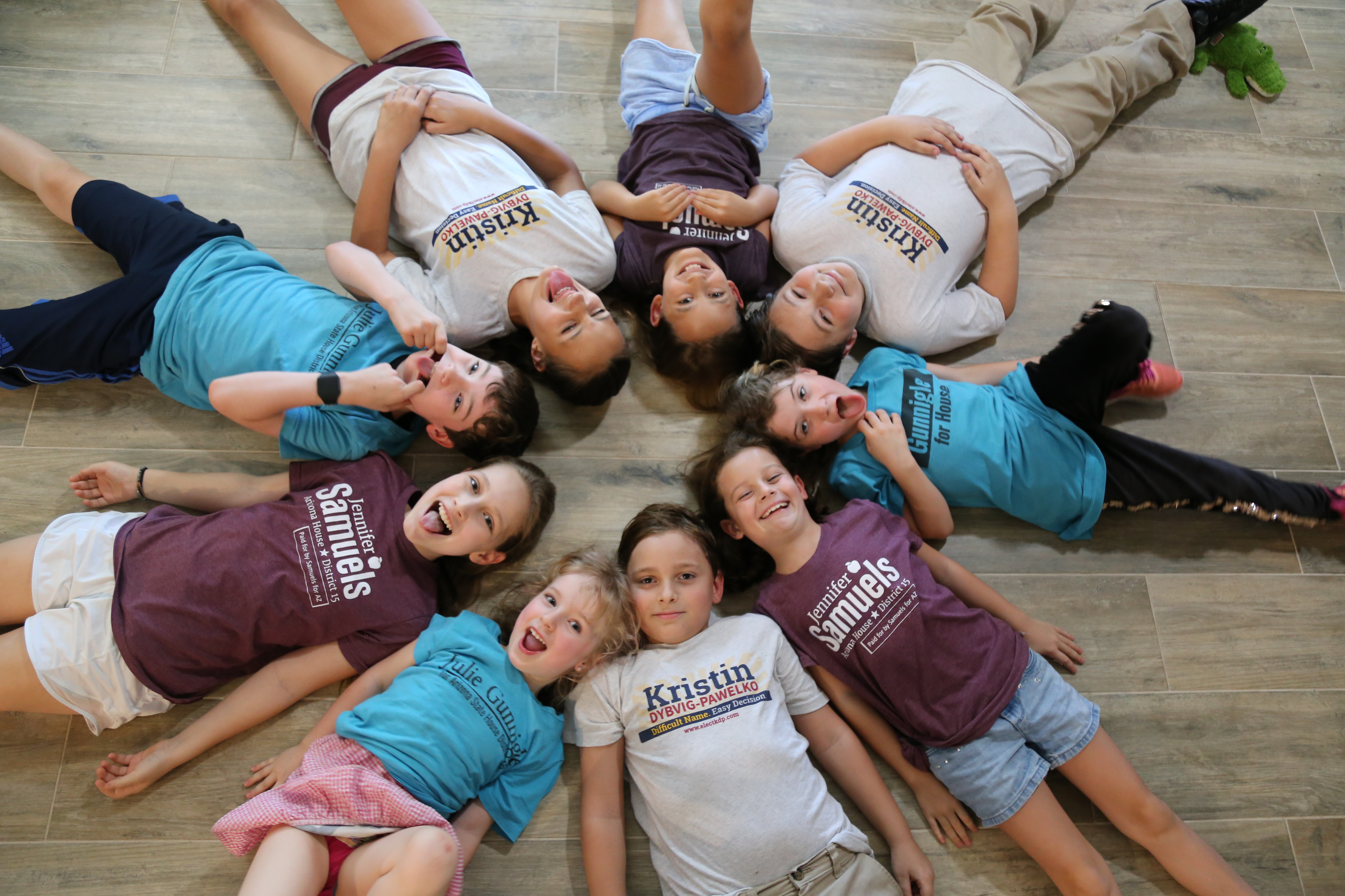 Beginning top left in blue, clockwise: Thomas Gunnigle, 10, Mia Dybvig-Pawelko, 13, Emily Gunnigle, 10, Wyatt Dybvig-Pawelko, 11, Vivian Gunnigle, 7, Hannah Samuels, 8, Mathieu Dybvig-Pawelko, 8, Violet Gunnigle 4, and Mandy Samuels, 12.