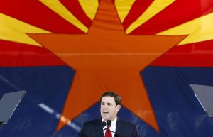 In this Jan. 5, 2015, file photo, Republican Arizona Gov. Doug Ducey addresses the crowd after being sworn in during an inauguration ceremony at the Arizona Capitol in Phoenix. (AP Photo/Ross D. Franklin, File)