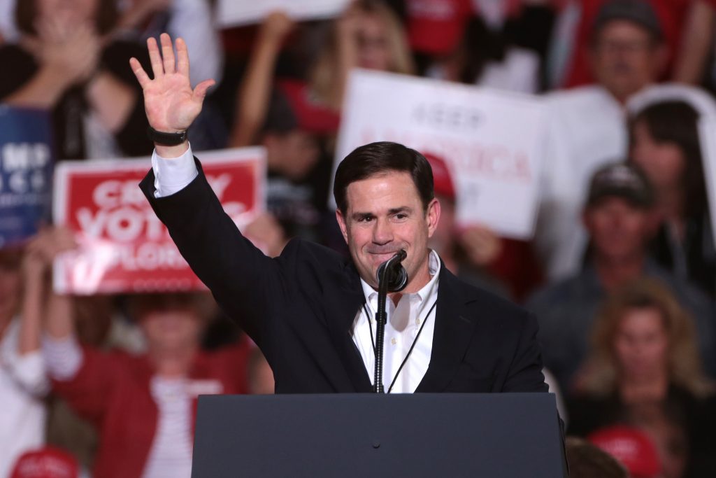 Gov. Doug Ducey waves to supporters at a Make America Great Again campaign rally for President Trump in Mesa on Oct. 19, 2018. Ducey has been a leading fundraiser in the 2018 election. (Photo by Gage Skidmore/Flickr)