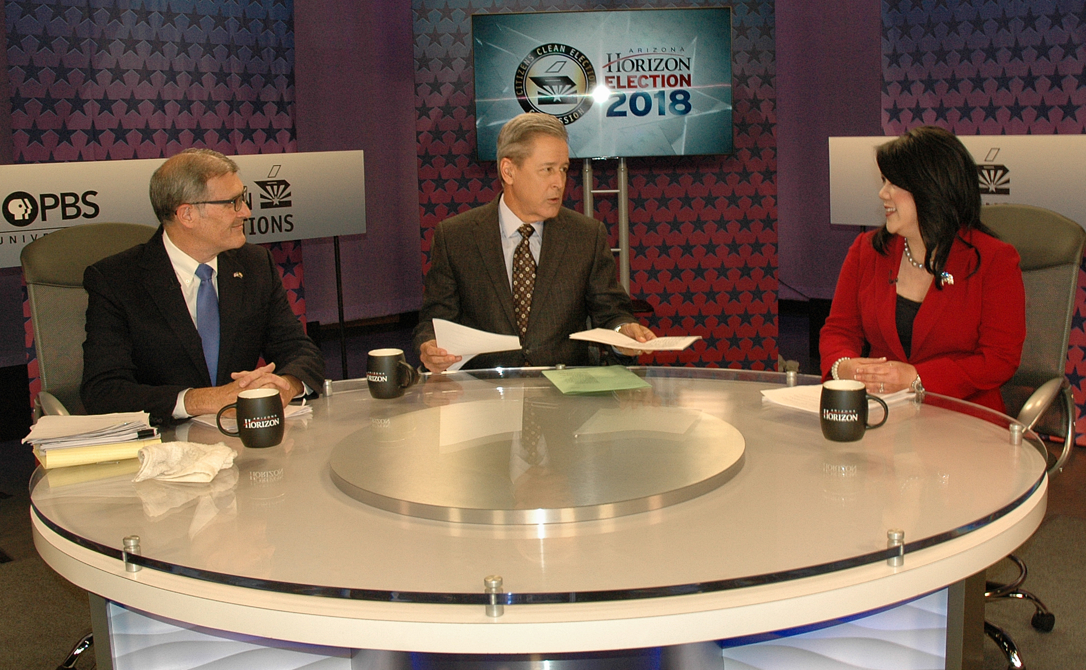 From left are Democratic State Treasurer candidate Mark Manoil, debate moderator Ted Simons, and Republican candidate Kimberly Yee. Yee and Manoil met Oct. 9, 2018, in a debate held at the studios of KAET-TV in Phoenix. (Photo by Howard Fischer/Capitol Media Services)