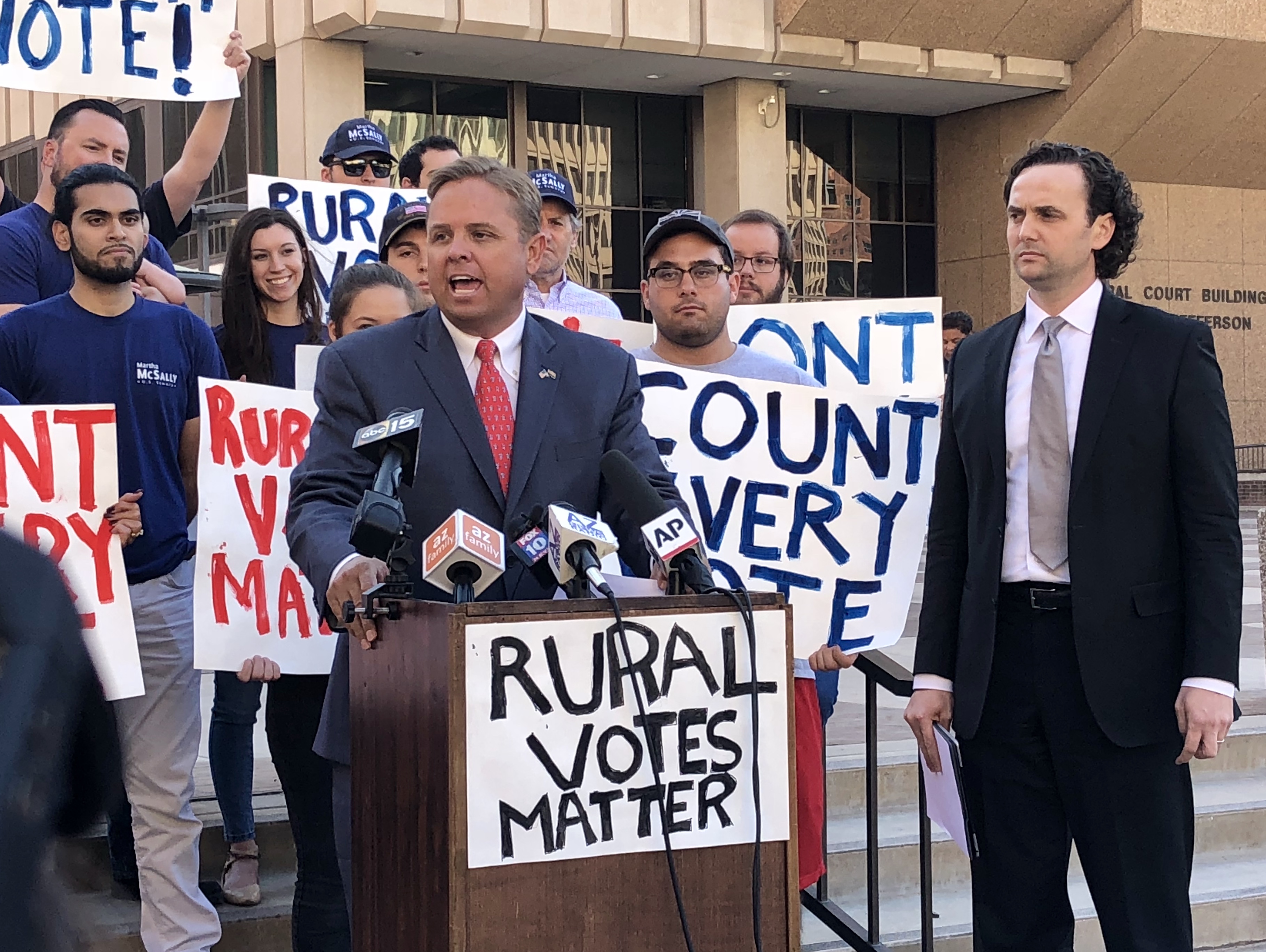 From left, Jonathan Lines, chairman of the Arizona Republican Party, and attorney Kory Langhofer addressed reporters ahead of their 2 p.m. hearing in Maricopa County Superior Court for less than three minutes. Though they had called the press conference, they took just two questions regarding claims that "Democrats are stealing this election." (Photo by Katie Campbell/Arizona Capitol Times)