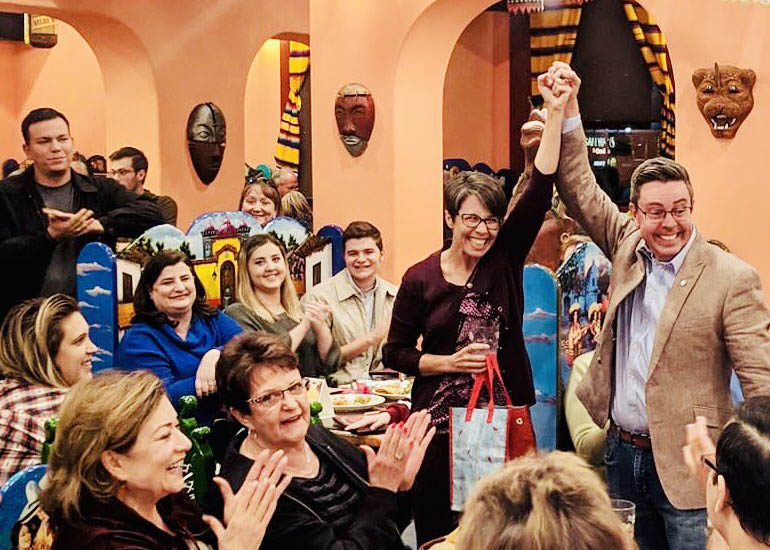 Democratic Senate candidate Steve Weichert raises Democratic Rep.-Elect Jennifer Pawlik's fist in celebration of her victory in the Legislative District 17 House race on Nov. 13.