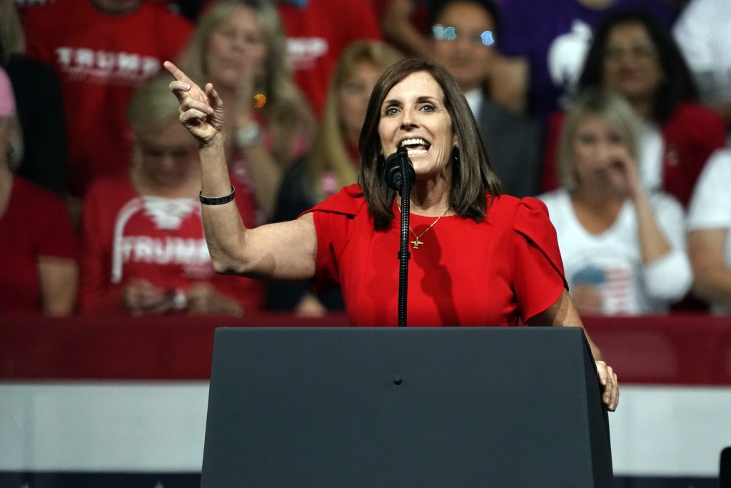 In this Feb. 19, 2020, file photo, Sen. Martha McSally, R-Ariz., speaks at a rally for President Donald Trump in Phoenix, campaigning in the traditional way. But now, the global pandemic that is shaking up life is also forcing Arizona's U.S. Senate candidates to reinvent the political playbook when voters are much more concerned about staying healthy and paying the bills than they are with politics. PHOTO BY RICK SCUTERI/ASSOCIATED PRESS