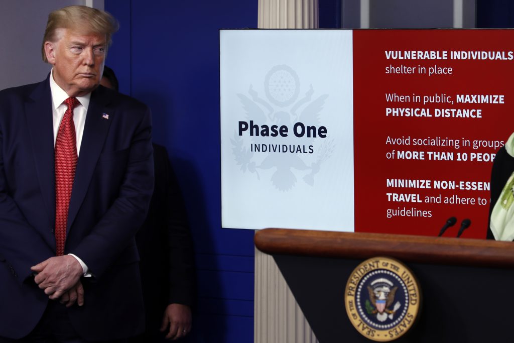 President Donald Trump listens as Dr. Deborah Birx, White House coronavirus response coordinator, speaks about the coronavirus in the James Brady Press Briefing Room of the White House, Thursday, April 16, 2020, in Washington. (AP Photo/Alex Brandon)