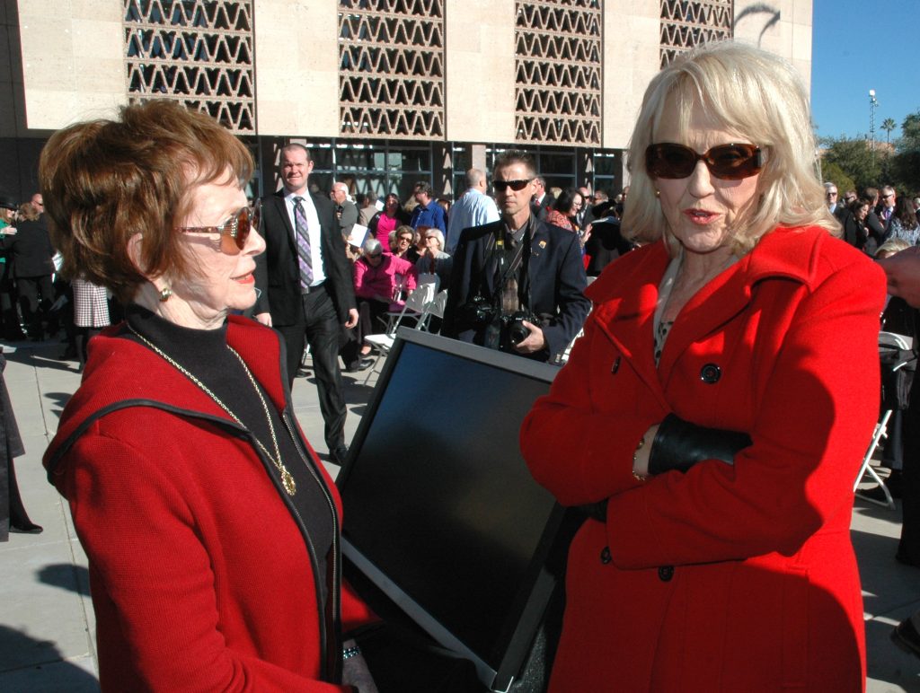 Former Gov. Jane Hull, left, with Jan Brewer at the 2015 swearing-in ceremony for Doug Ducey. (Capitol Media Services photo by Howard Fischer)