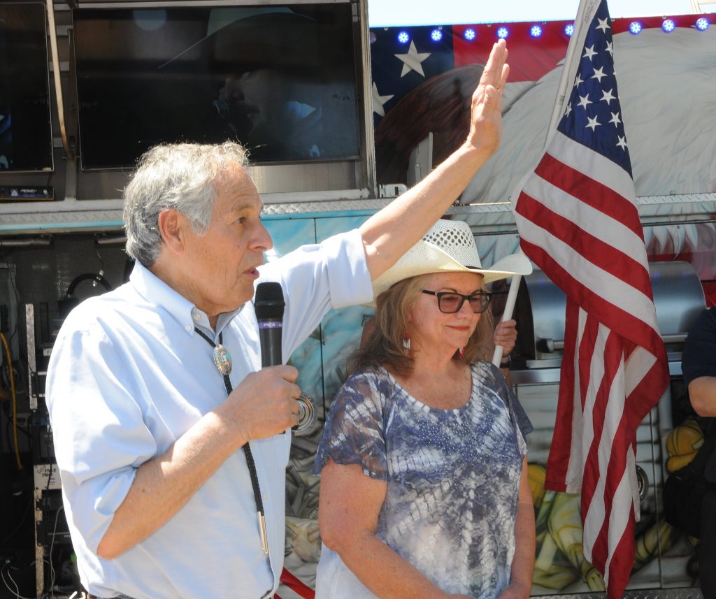 Winslow business owners Dan Mazon, who was cited for keeping open his Authentic Indian Arts Store, tells protesters Monday that his constitutional rights were illegally suspended. (Capitol Media Services photo by Howard Fischer)