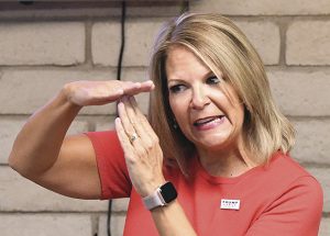 Dr. Kelli Ward, chairperson of the Republican Party of Arizona, speaks to a gathering inside the Yuma GOP Headquarters, Monday Aug. 17, 2020, before introducing U.S. Congressman Paul A. Gosar. (Randy Hoeft/Yuma Sun via AP)