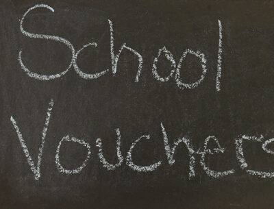 school vouchers written on a chalkboard