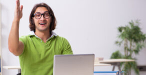 In this photo illusttration, a young man is studying in the classroom. (Deposit Photo)