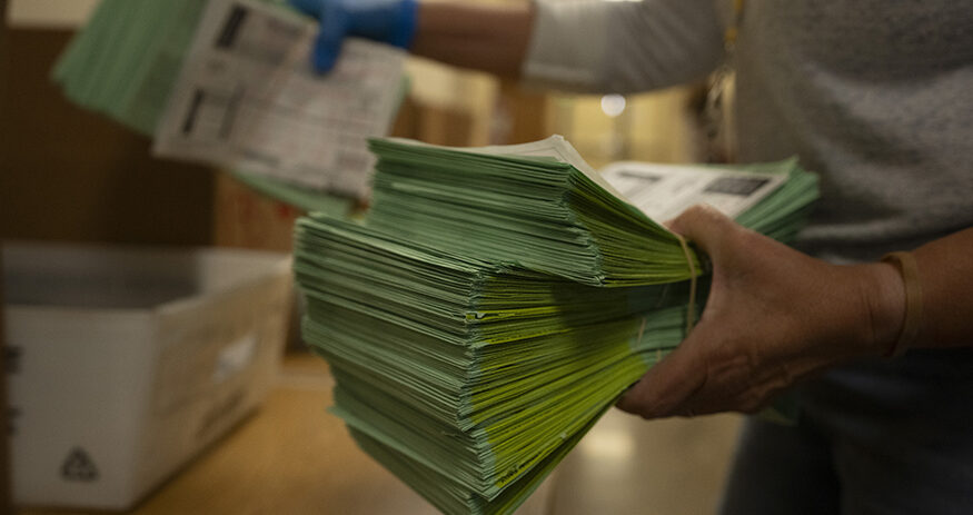 An election official sorts mail ballots at the Maricopa County Tabulation and Election Center in Phoenix, Tuesday, March 5, 2024