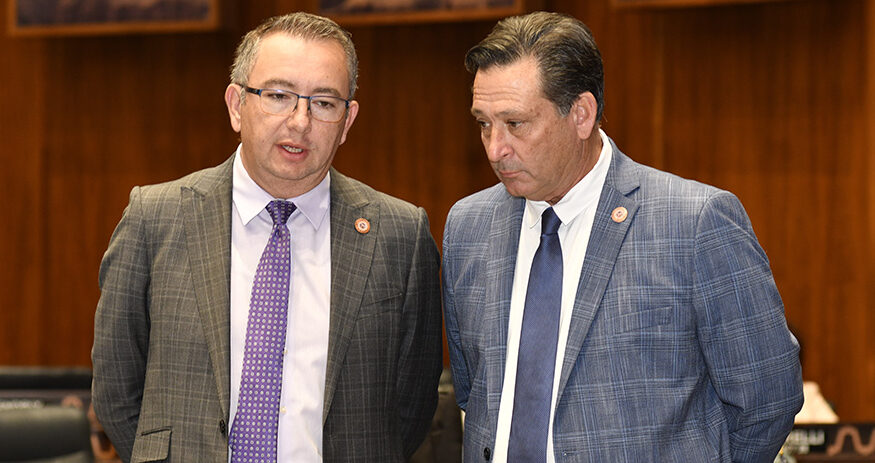 House Speaker Ben Toma, left, confers with Rep. David Cook ahead of a vote on whether to debate repeal of the state's 1864 abortion law. Cook agreed to delay action even though he said he believes the law is out of date. (Capitol Media Services photo by Howard Fi