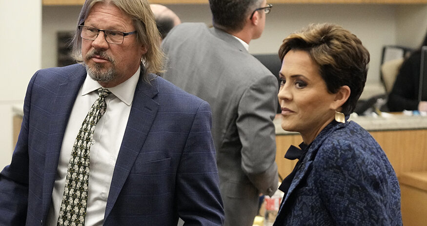 Former Arizona Republican governor candidate Kari Lake, right, stands next to her attorney Bryan Blehm at Maricopa County Superior Court during a voting records trial Thursday, Sept. 21, 2023, in Phoenix. (AP Photo/Ross D. Franklin, Pool)