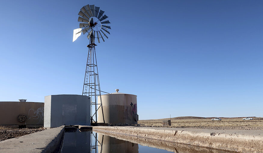 A windmill draws water for livestock in Leupp, Ariz., on the Navajo Nation, Saturday, March 9, 2024. A proposed water rights settlement for three Native American tribes that carries a price tag larger than any such agreement enacted by Congress took a significant step forward late Monday, May 13, with introduction in the Navajo Nation Council. (AP Photo/Felicia Fonseca)