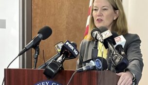 Arizona Attorney General Kris Mayes speaks to reporters about the indictment of three former Arizona Department of Education employees on charges they defrauded the state's education voucher program out of more than $600,000, Thursday, Feb. 29, 2024 in Phoenix. Dorrian Jones was the sole defendant to go to trial after Lopez entered a testimonial agreement with the state, and Sweet and her children agreed to plea deals. (AP Photo/Jacques Billeaud)